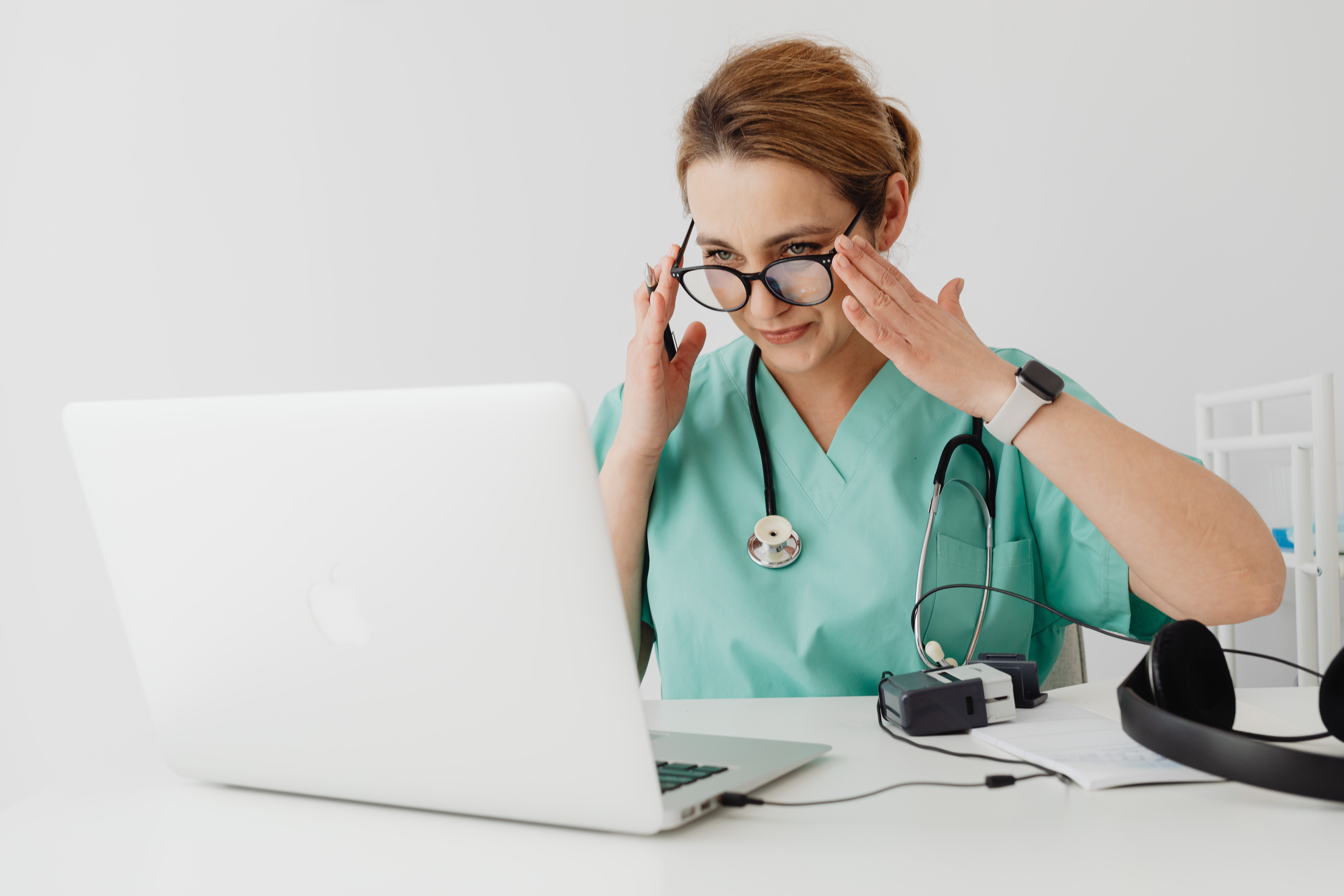 woman in teal scrubs